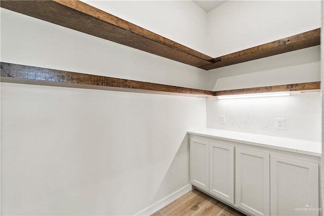 1114 Knotty Pine Ln, Harlingen, TX 78552 - detailed view of wood finished floors and baseboards