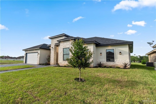 1114 Knotty Pine Ln, Harlingen, TX 78552 - view of front of property with stone siding, asphalt driveway, a garage, a front yard, and stucco siding