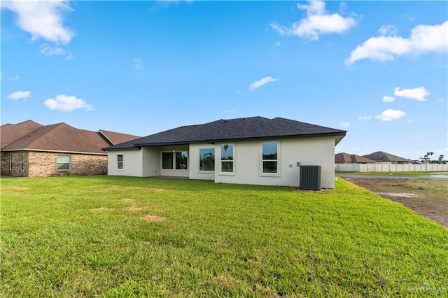 1114 Knotty Pine Ln, Harlingen, TX 78552 - back of property with stucco siding and a yard