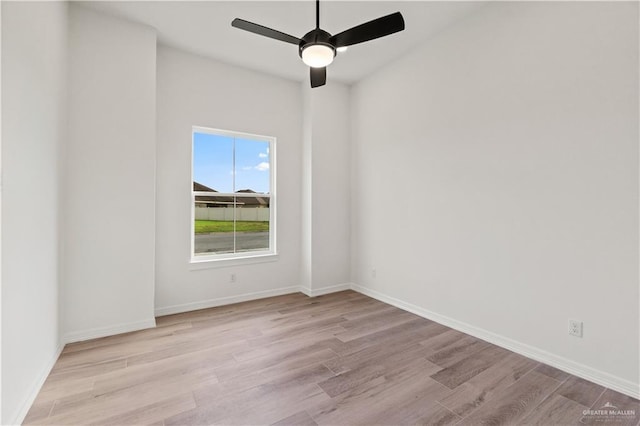 1114 Knotty Pine Ln, Harlingen, TX 78552 - empty room with wood finished floors and a ceiling fan