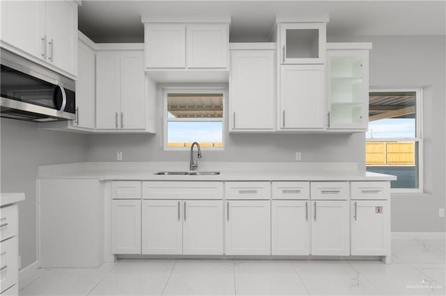 kitchen with white cabinetry and sink