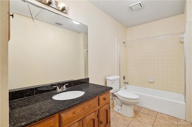 full bathroom with tile patterned flooring, vanity, toilet, and tiled shower / bath