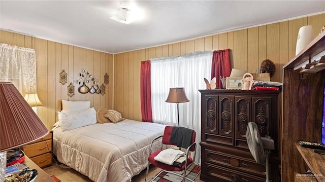 bedroom featuring wooden walls