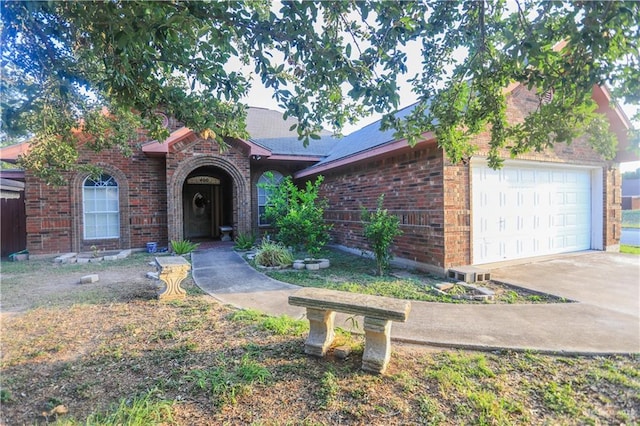 view of front of property with a garage