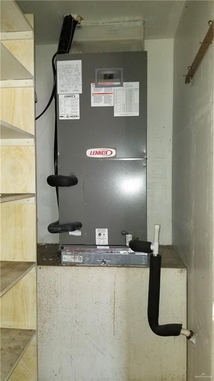 utility room with heating unit