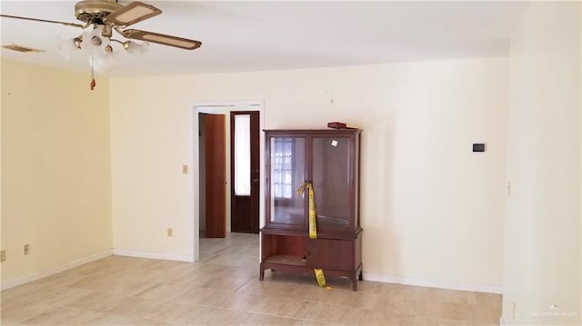 unfurnished room featuring ceiling fan