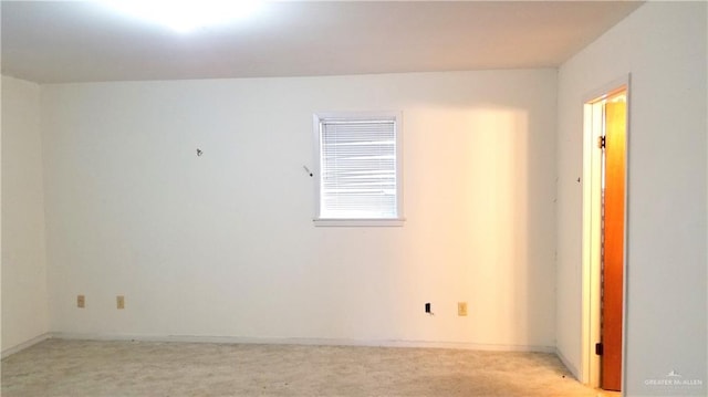 empty room featuring light colored carpet