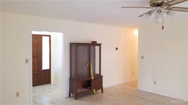 unfurnished room with ceiling fan