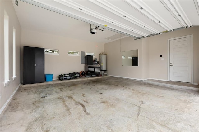garage featuring gas water heater and a garage door opener