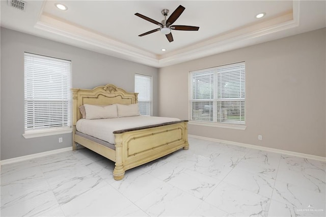 bedroom featuring baseboards, recessed lighting, visible vents, and a tray ceiling
