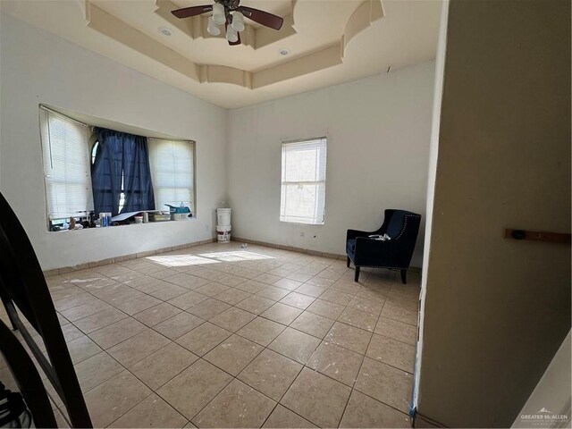 2011 Loma Verde Dr, San Juan, TX 78589 - unfurnished room featuring light tile patterned flooring, a ceiling fan, and a tray ceiling