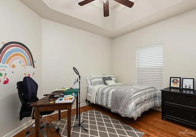 bedroom with a ceiling fan and wood finished floors