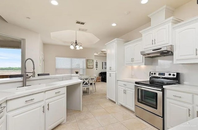 kitchen with visible vents, light countertops, electric stove, an inviting chandelier, and under cabinet range hood