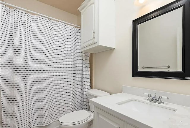 full bathroom with vanity, a shower with curtain, and toilet