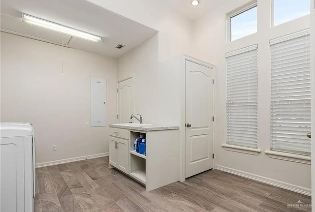 bathroom featuring recessed lighting, baseboards, washer / dryer, wood finished floors, and visible vents