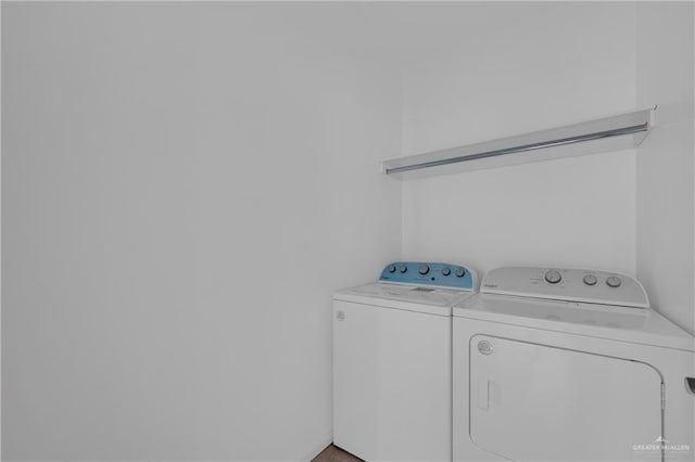 laundry room featuring washer and dryer and laundry area