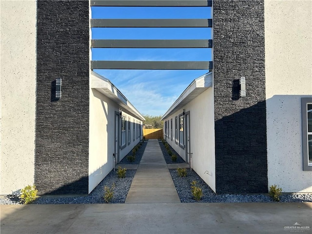 view of side of home featuring stucco siding