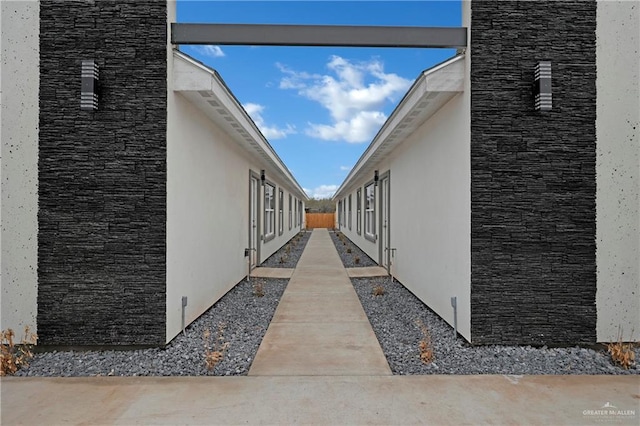 view of side of property with stucco siding