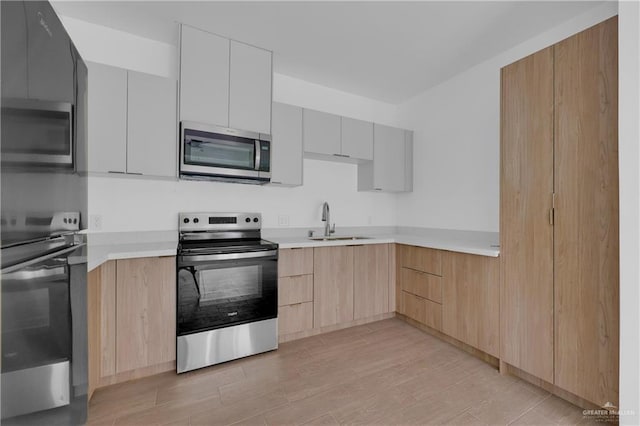 kitchen featuring appliances with stainless steel finishes and modern cabinets