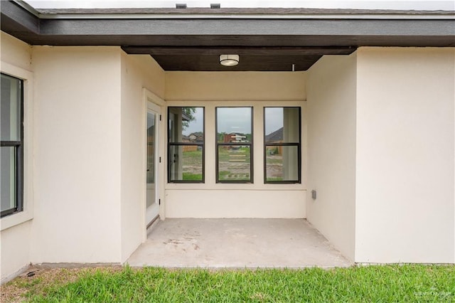 doorway to property featuring a patio