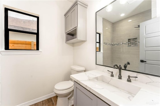 bathroom featuring hardwood / wood-style floors, vanity, and toilet