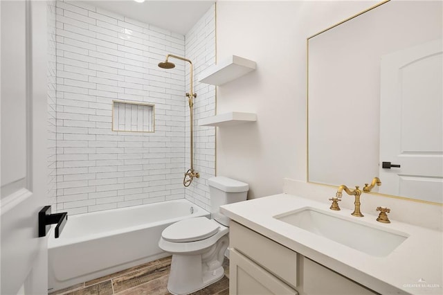 full bathroom with tiled shower / bath, wood-type flooring, toilet, and vanity