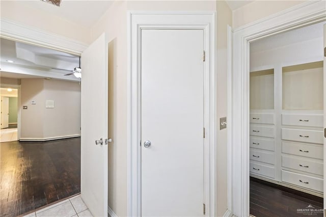 corridor with hardwood / wood-style floors