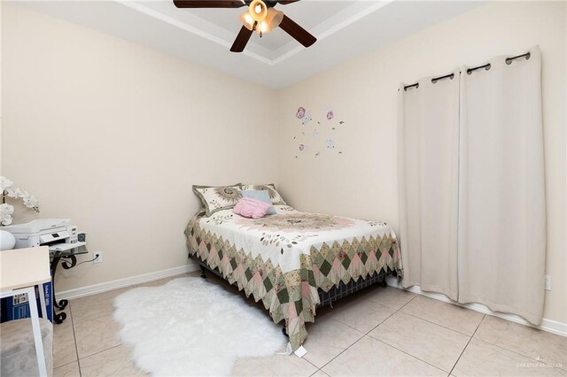 bedroom with tile patterned floors and ceiling fan