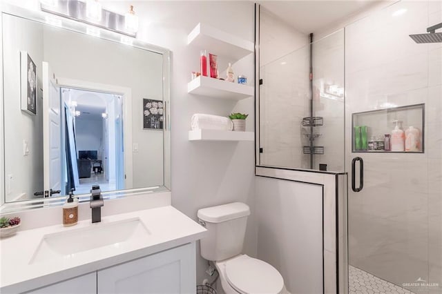 713 Santa Cecilia St, Donna, TX 78537 - bathroom featuring vanity, a shower stall, and toilet