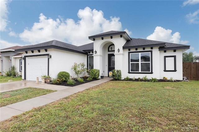 713 Santa Cecilia St, Donna, TX 78537 - view of front of house featuring stucco siding, driveway, fence, and a garage