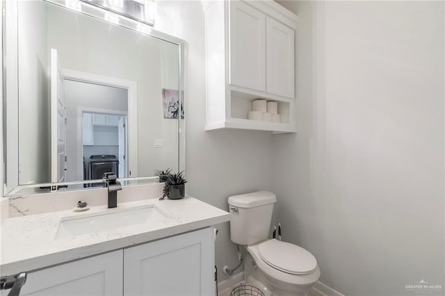 713 Santa Cecilia St, Donna, TX 78537 - bathroom with baseboards, vanity, and toilet