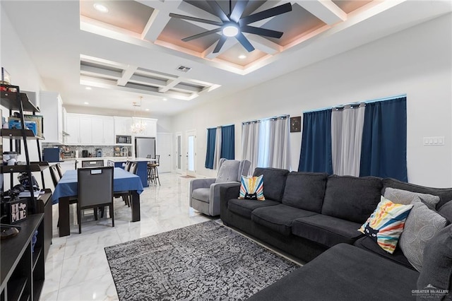 713 Santa Cecilia St, Donna, TX 78537 - living area featuring marble finish floor, coffered ceiling, visible vents, beamed ceiling, and ceiling fan with notable chandelier