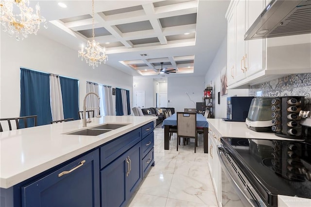 713 Santa Cecilia St, Donna, TX 78537 - kitchen featuring blue cabinets, under cabinet range hood, a sink, and electric stove