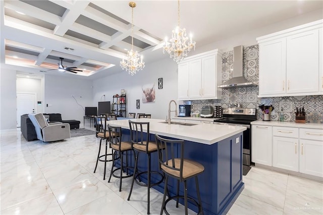 713 Santa Cecilia St, Donna, TX 78537 - kitchen with coffered ceiling, electric stove, a sink, wall chimney exhaust hood, and decorative backsplash