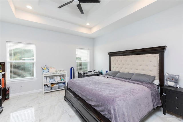 713 Santa Cecilia St, Donna, TX 78537 - bedroom with a ceiling fan, marble finish floor, a tray ceiling, baseboards, and recessed lighting