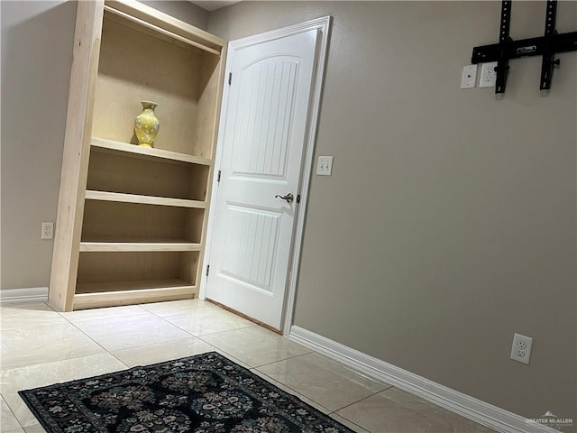 interior space featuring built in features and baseboards