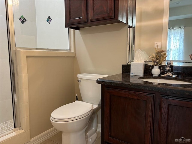 full bath featuring toilet, an enclosed shower, vanity, and tile patterned floors