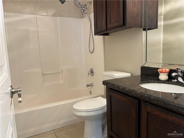 bathroom featuring vanity, shower / bathing tub combination, tile patterned flooring, and toilet