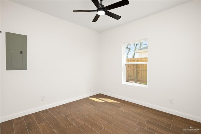 unfurnished room featuring ceiling fan and electric panel