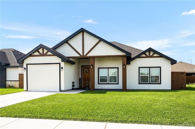 english style home with an attached garage, driveway, stucco siding, and a front lawn
