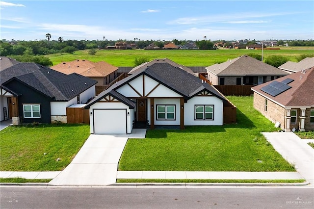 view of front of home featuring an attached garage, a residential view, driveway, and stucco siding
