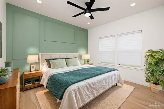 bedroom featuring recessed lighting, light wood-style floors, baseboards, and ceiling fan