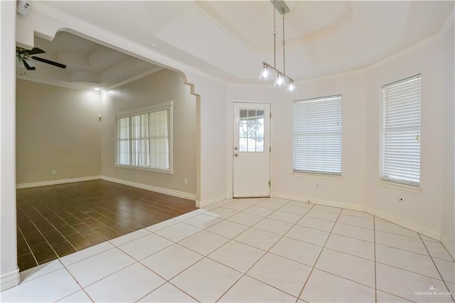 2320 Pelican Ave, Mcallen, TX 78504 - entrance foyer with a tray ceiling, crown molding, a ceiling fan, baseboards, and wood finished floors
