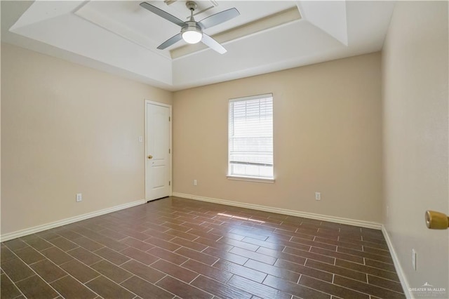 2320 Pelican Ave, Mcallen, TX 78504 - empty room featuring a tray ceiling, ceiling fan, and baseboards