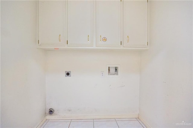 2320 Pelican Ave, Mcallen, TX 78504 - laundry area with electric dryer hookup, washer hookup, cabinet space, tile patterned floors, and baseboards