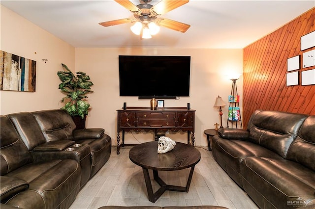 520 W Upas Ave, Mcallen, TX 78501 - living area featuring wooden walls, light wood finished floors, and ceiling fan