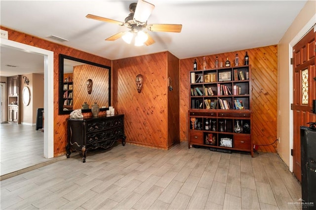 520 W Upas Ave, Mcallen, TX 78501 - living area featuring wood walls, ceiling fan, and wood finished floors