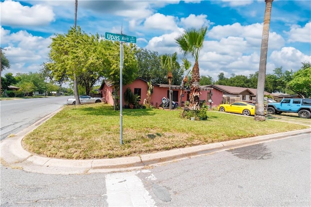 520 W Upas Ave, Mcallen, TX 78501 - ranch-style home with a front lawn and a residential view