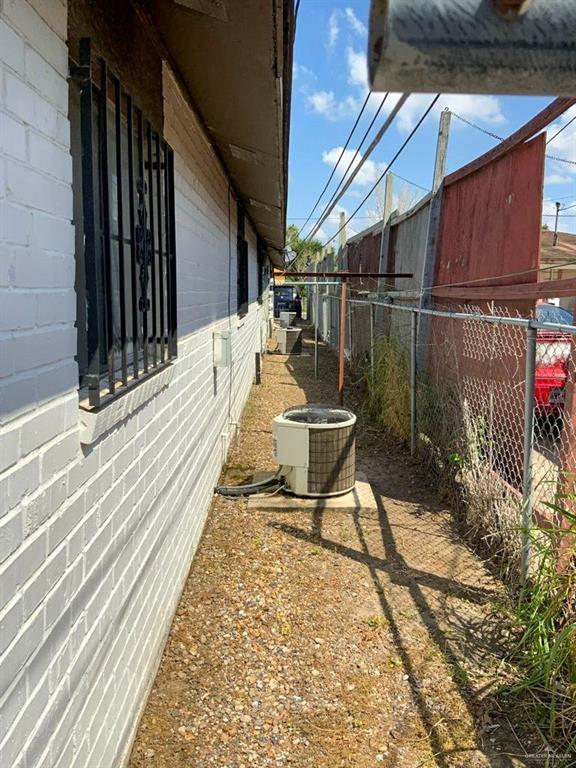 view of side of property featuring central AC