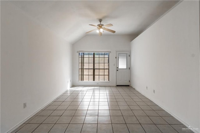 tiled empty room with lofted ceiling and ceiling fan